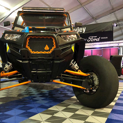 UTV parked on top of Ribtrax Pro garage flooring tiles at a tradeshow